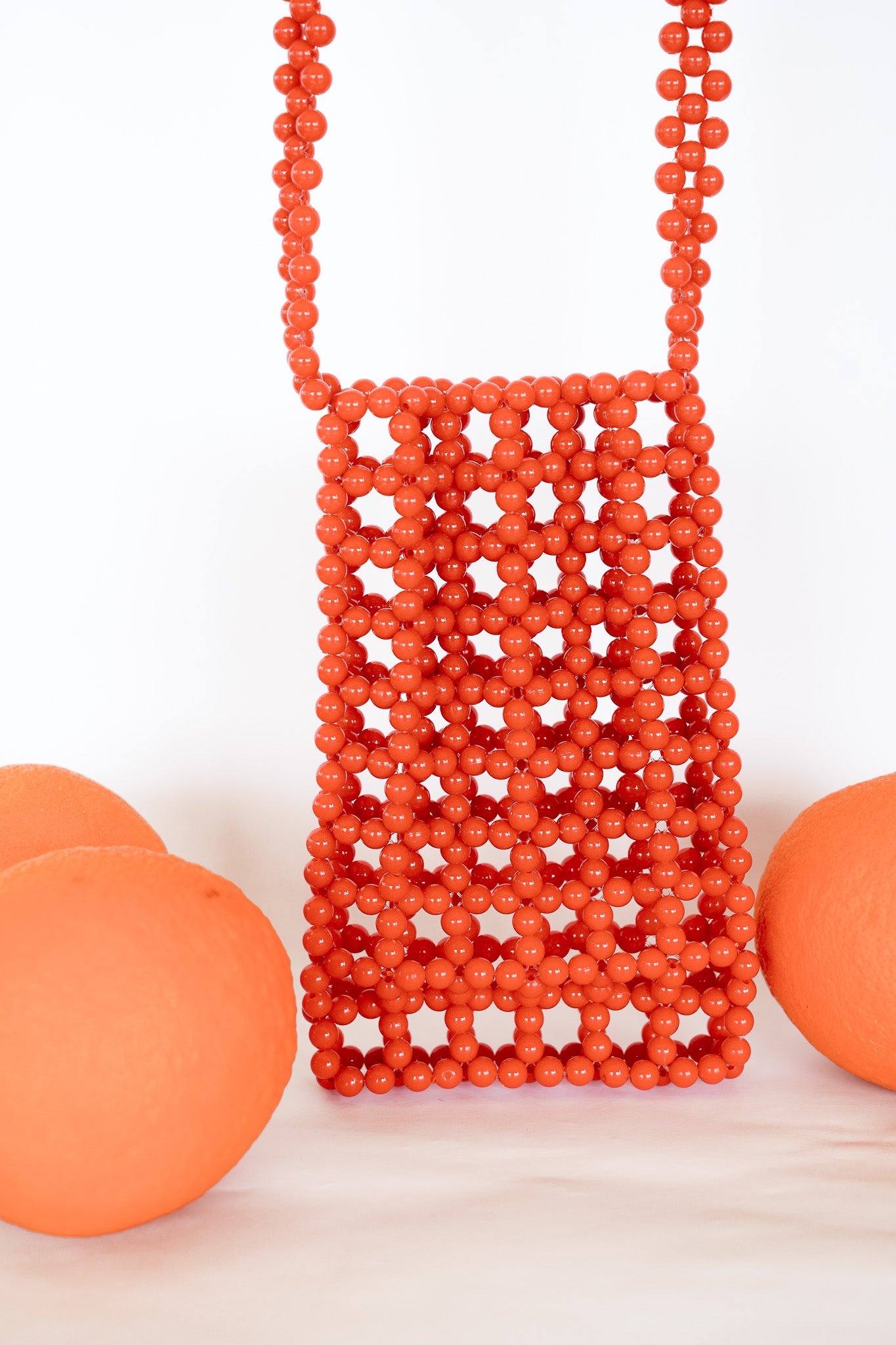 BEADED PHONE BAG - SUNSET RED