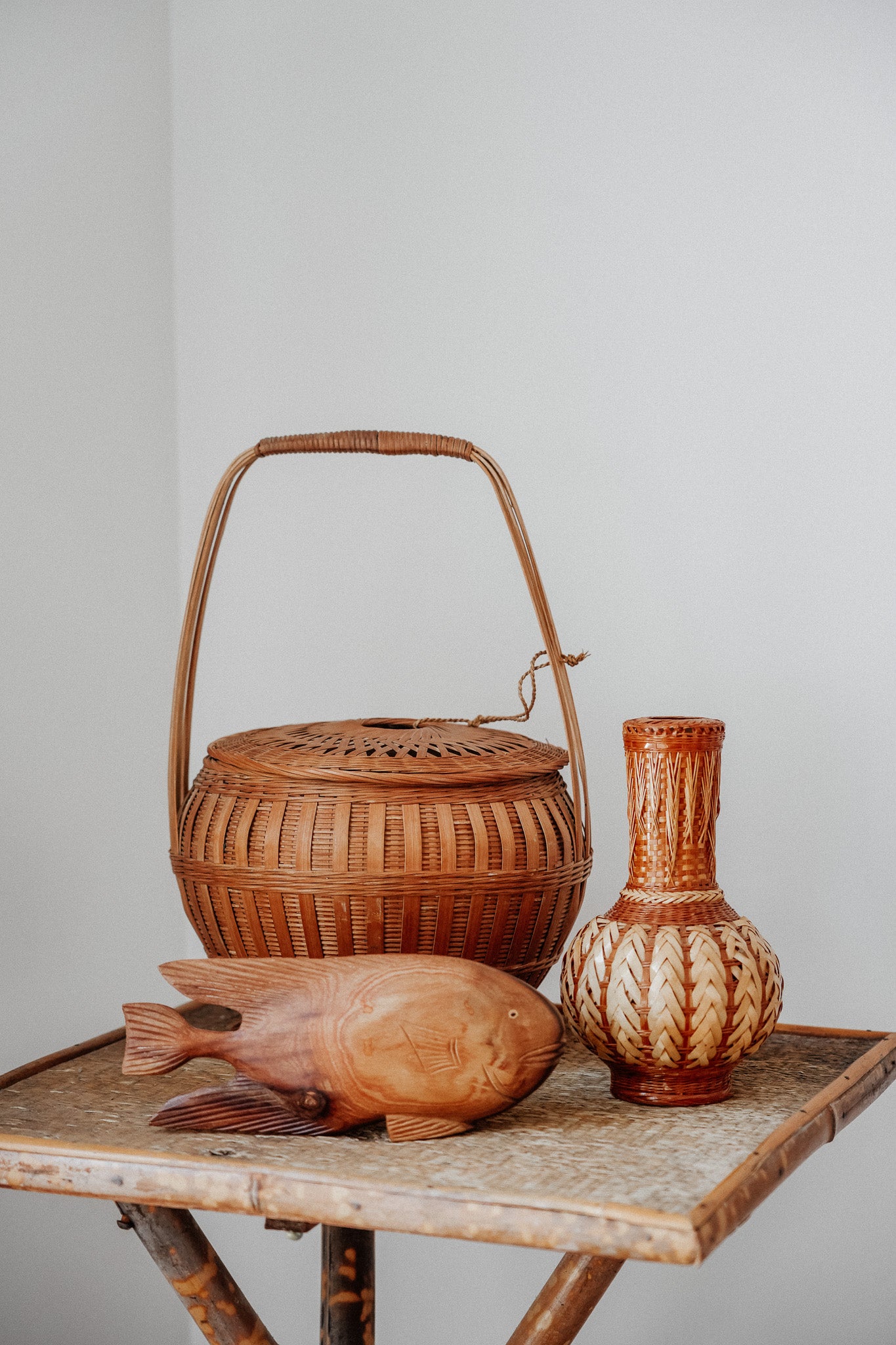Woven basket with tie on lid