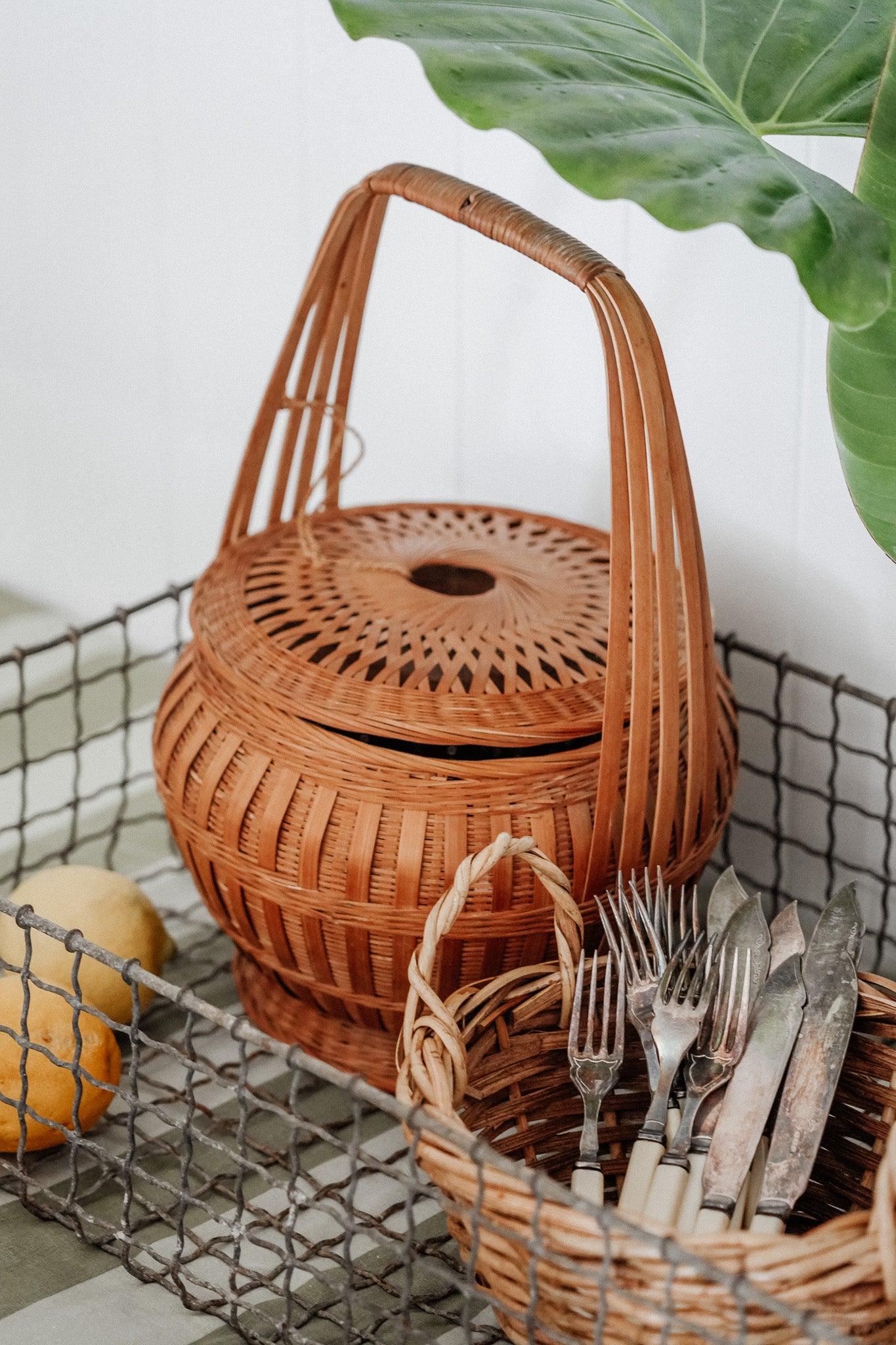 Woven basket with tie on lid