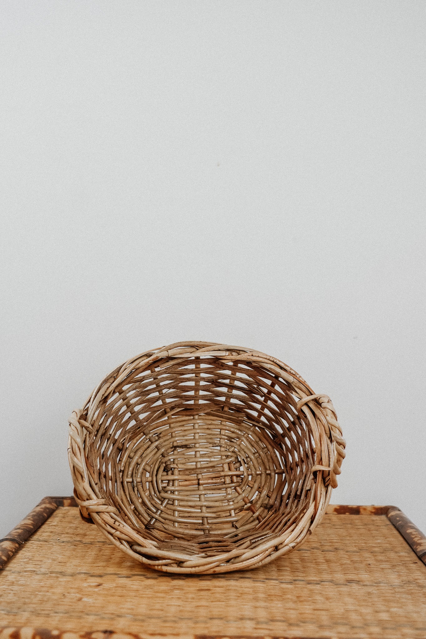 Oval cane basket with side handles