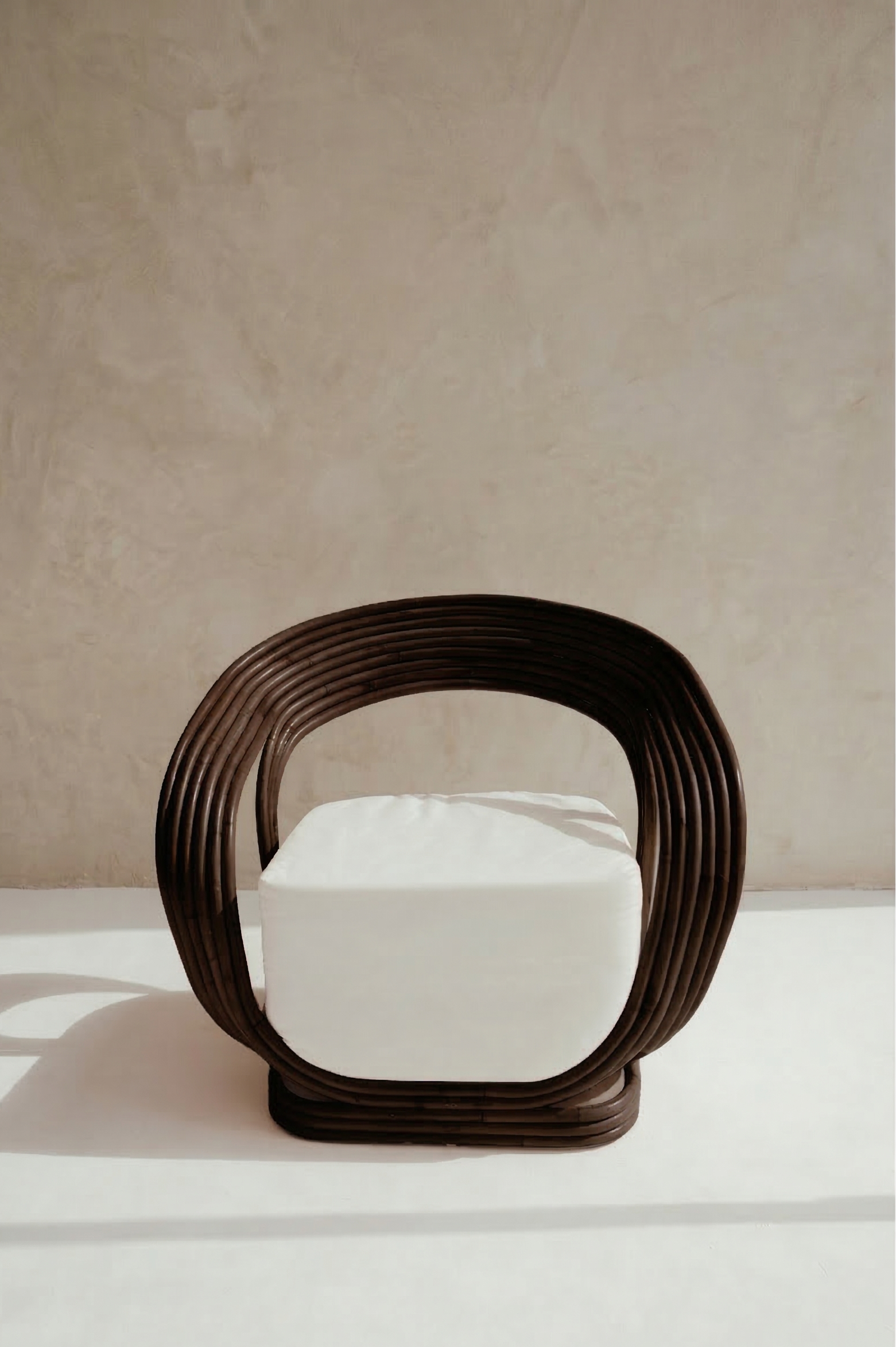 Modern chair with a rattan design on a neutral background